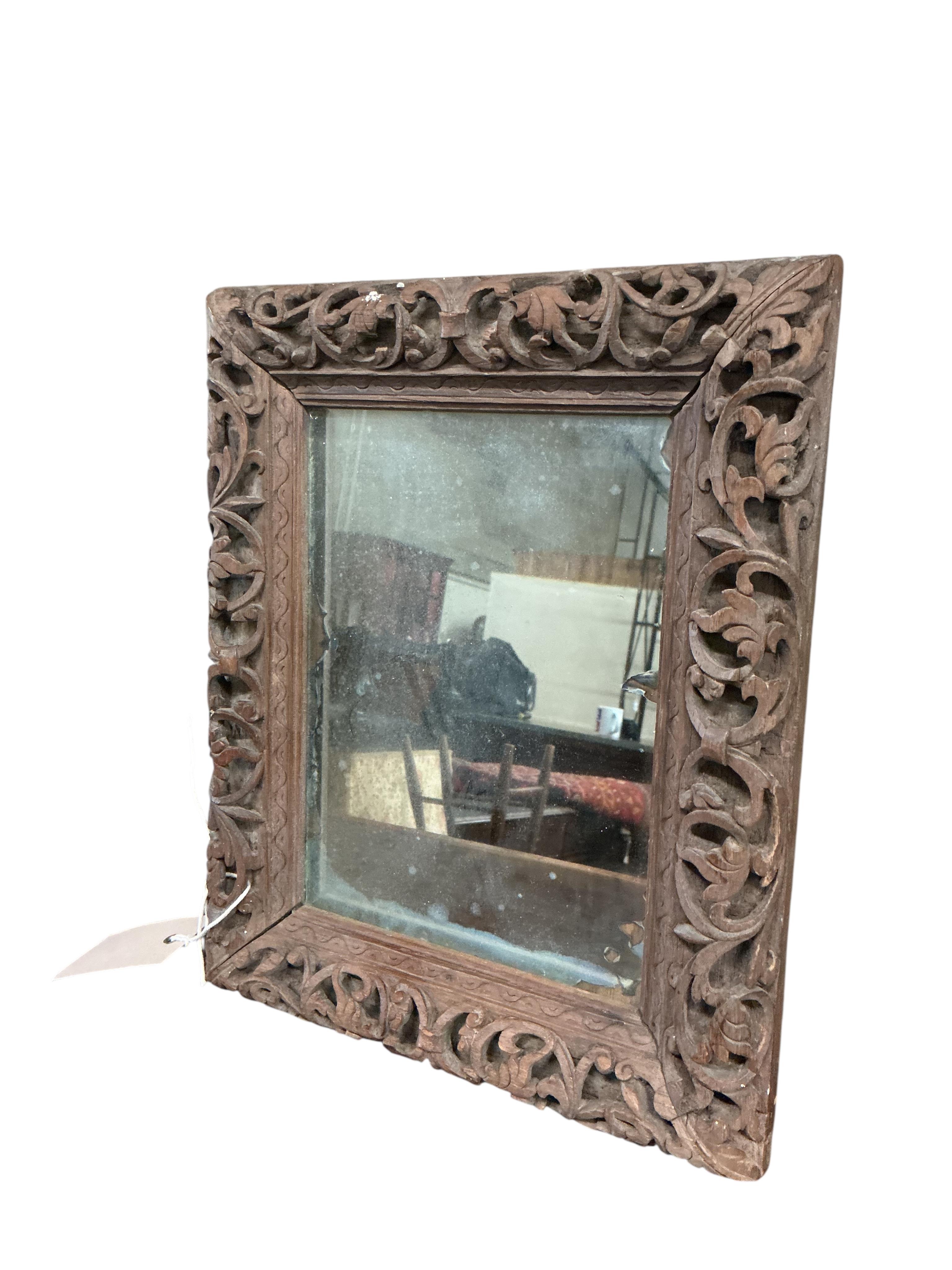 A pair of small Victorian rectangular carved oak wall mirrors, width 22cm, height 28cm